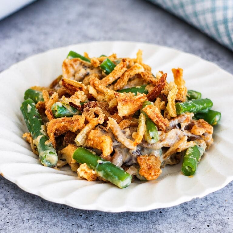 Creamy mushroom and green bean filling on a tortilla, topped with crispy fried tortilla strips